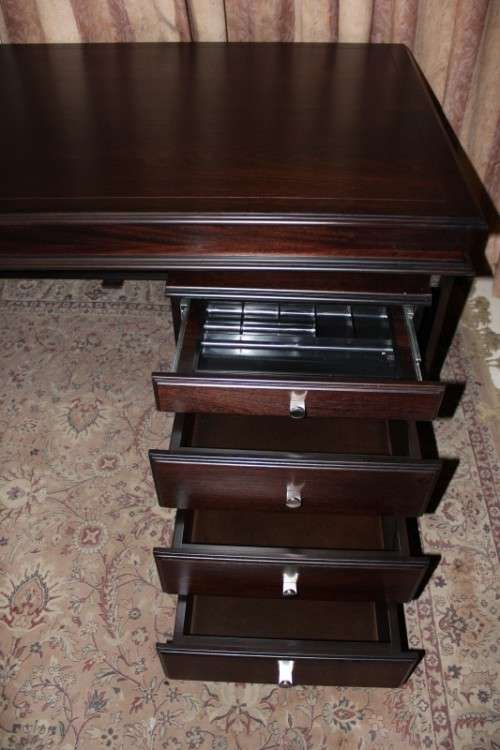An amazing 'new" well made large darkened Oak executives desk with a 4 drawer removable pedestal