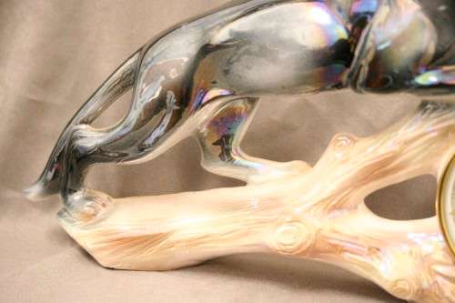 A gorgeous, decorative German made porcelain Jaguar wind up clock.