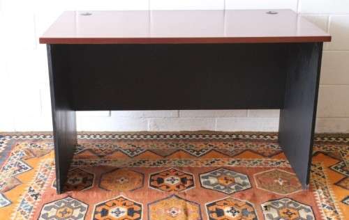 A lovely cherry-wood colour and black framed 120cm office/ study desk - perfect for a smaller space