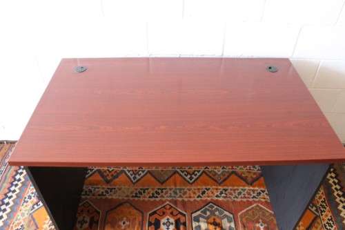 A lovely cherry-wood colour and black framed 120cm office/ study desk - perfect for a smaller space