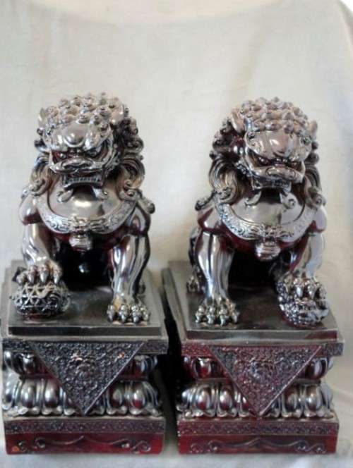 A spectacular pair of Oriental large red resin foo dogs/ temple lions in stunning condition.