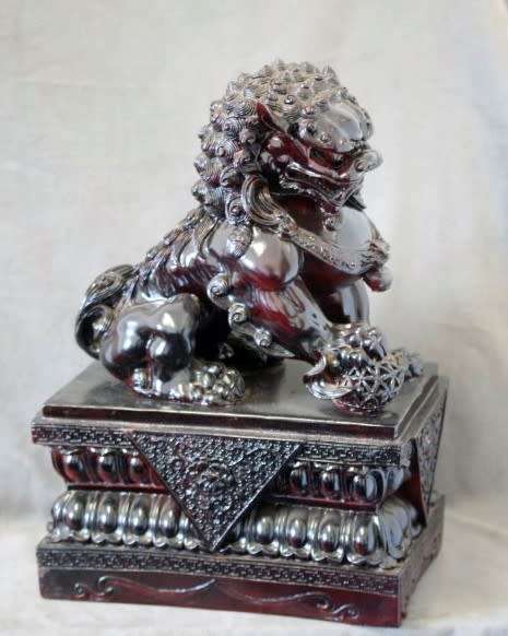 A spectacular pair of Oriental large red resin foo dogs/ temple lions in stunning condition.