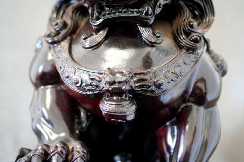 A spectacular pair of Oriental large red resin foo dogs/ temple lions in stunning condition.