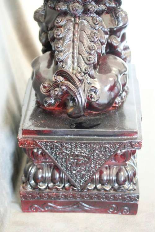 A spectacular pair of Oriental large red resin foo dogs/ temple lions in stunning condition.
