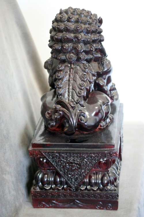 A spectacular pair of Oriental large red resin foo dogs/ temple lions in stunning condition.