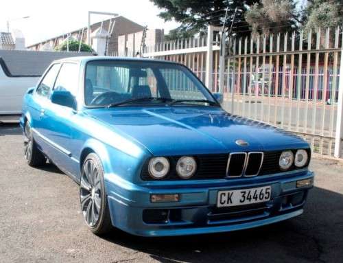 A highly collectible 1989 BMW (E30) converted to 325IS Coupe in metallic blue 99% restored.