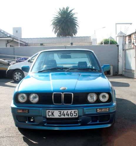 A highly collectible 1989 BMW (E30) converted to 325IS Coupe in metallic blue 99% restored.