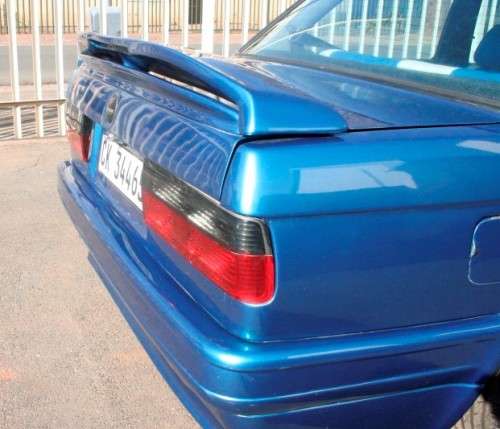A highly collectible 1989 BMW (E30) converted to 325IS Coupe in metallic blue 99% restored.