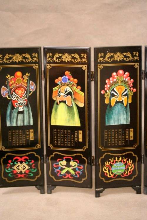 A stunning six-panel black lacquer ornamental divider depicting the "facial make up of Peking Opera"