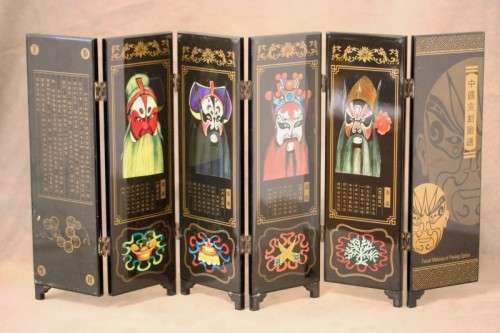 A stunning six-panel black lacquer ornamental divider depicting the "facial make up of Peking Opera"