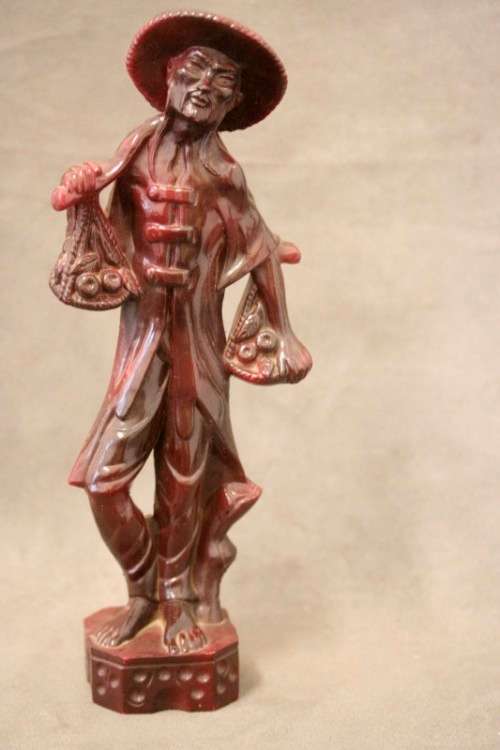 A pair of ornamental Chinese plastic figurines, a fisherman and veg seller, fabulous on display.