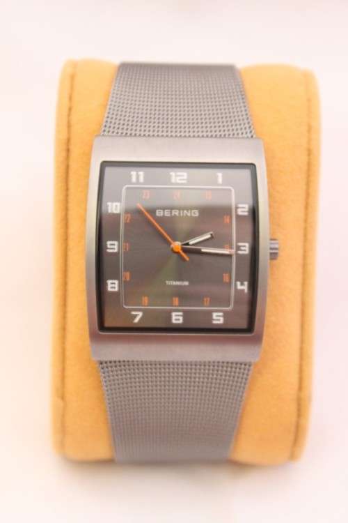 An incredible Bering "Classic" Titanium Slim men's watch with an adjustable black mesh strap