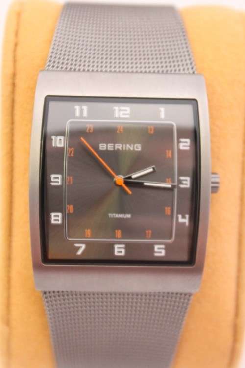 An incredible Bering "Classic" Titanium Slim men's watch with an adjustable black mesh strap