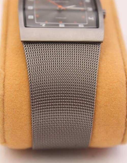 An incredible Bering "Classic" Titanium Slim men's watch with an adjustable black mesh strap