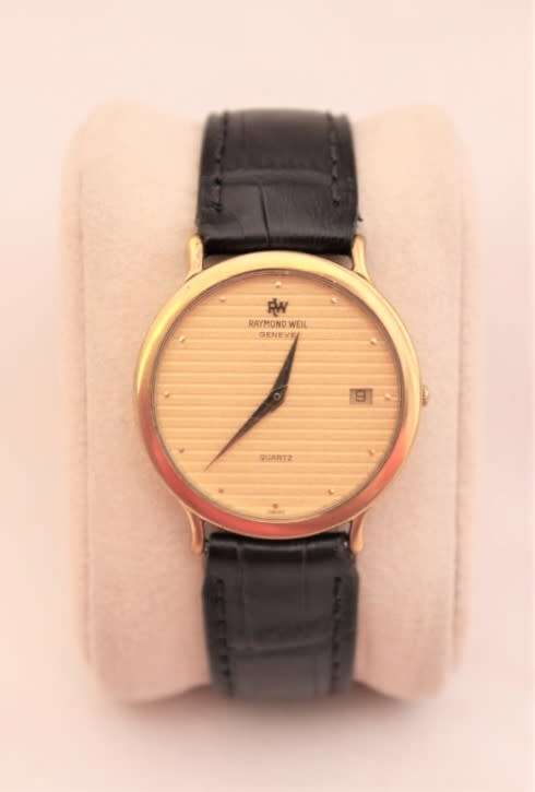 A stunning classic Raymond Weil gold plated gents quartz wrist watch with a black leather strap