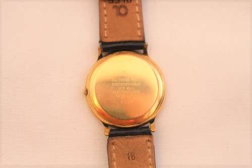 A stunning classic Raymond Weil gold plated gents quartz wrist watch with a black leather strap
