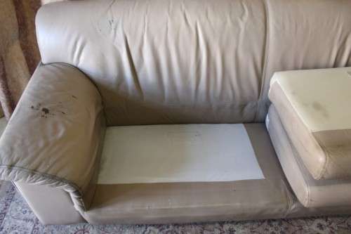 A lovely well made (235cm long) beige faux leather couch. Perfect in informal rooms, lapa etc