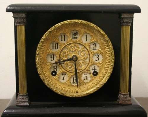 A beautiful, stylish vintage black wood "Sessions" wind up pendulum mantle clock. Working.