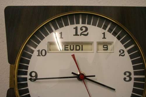 A stylish vintage French "Jaz" battery operated kitchen wall clock. Working.
