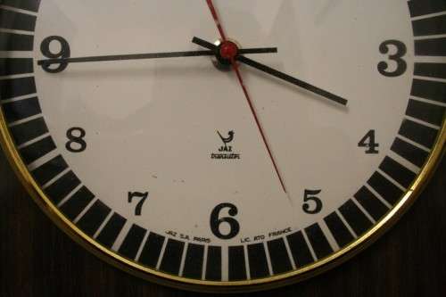 A stylish vintage French "Jaz" battery operated kitchen wall clock. Working.