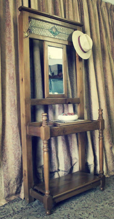 A gorgeous light wood hall stand with a coloured stained glass top, centre mirror and storage drawer