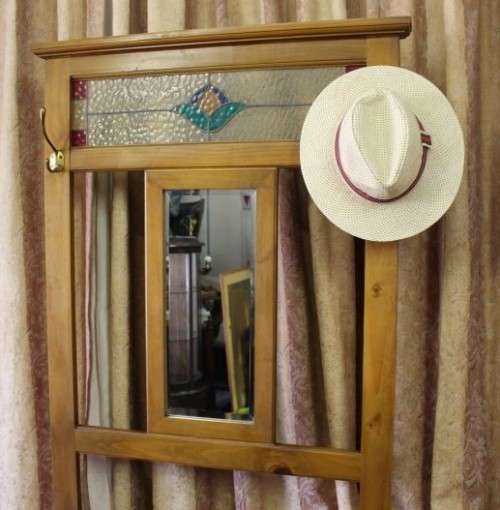 A gorgeous light wood hall stand with a coloured stained glass top, centre mirror and storage drawer
