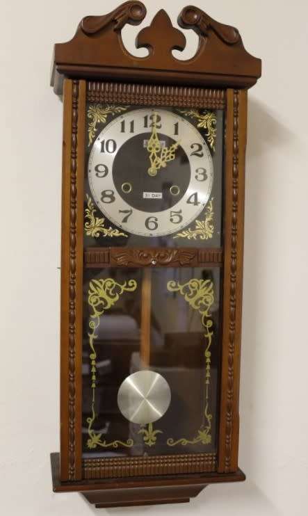 A beautiful, stylish vintage wall hanging "Blessings" 31 day wind up pendulum clock.