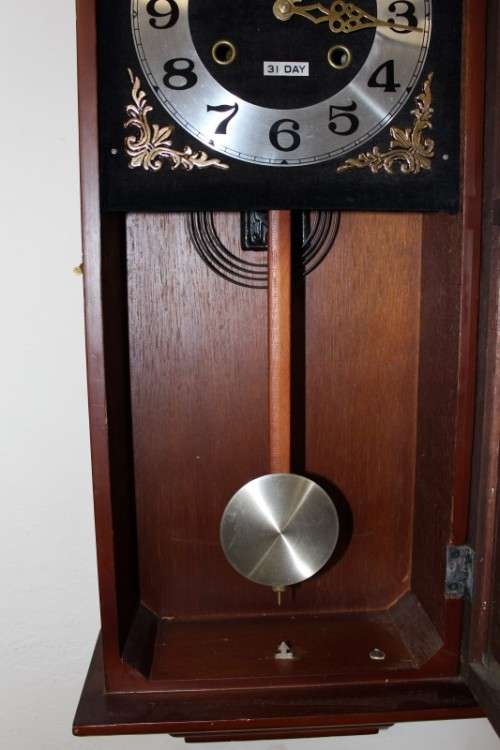 A beautiful, stylish vintage wall hanging "Blessings" 31 day wind up pendulum clock.