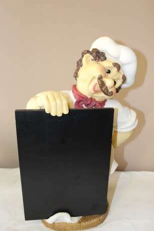 A magnificent hand crafted resin mold, hand painted menu holding chef statue. Amazing display piece