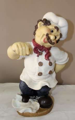 A magnificent hand crafted resin mold, hand painted menu holding chef statue. Amazing display piece