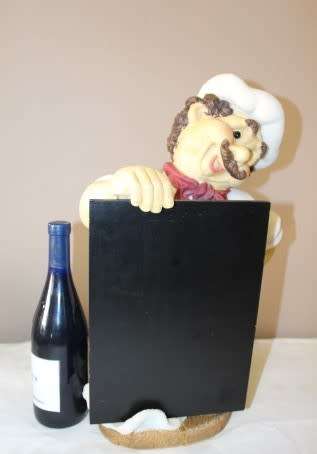 A magnificent hand crafted resin mold, hand painted menu holding chef statue. Amazing display piece