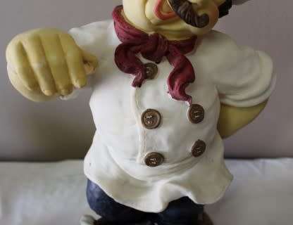 A magnificent hand crafted resin mold, hand painted menu holding chef statue. Amazing display piece