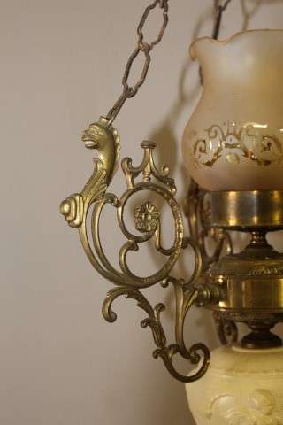 A gorgeous, elegant brass and ceramic ceiling light/ chandelier.  Lifespace Sale