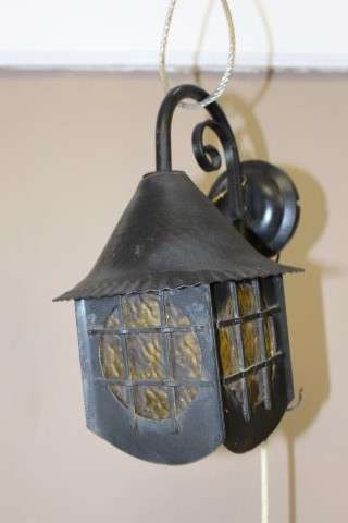 A lovely rustic black metal single wall fitted light, perfect in informal living areas.