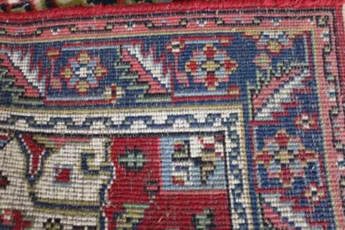 A stunning 95cm x 153cm hand knotted thick pile Persian carpet in dark reds. Gorgeous in all rooms!