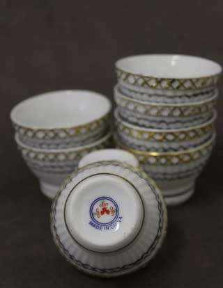 A very pretty traditional Chinese rice wine set of 8 cups with silver and gold gilt.