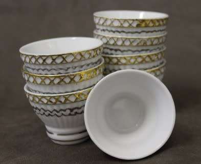 A very pretty traditional Chinese rice wine set of 8 cups with silver and gold gilt.
