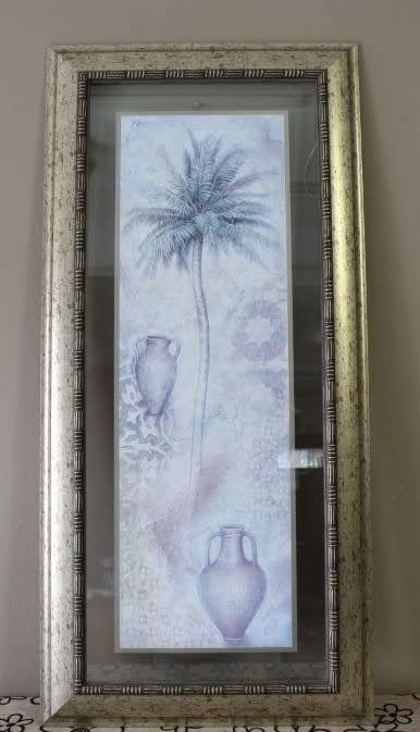 A beautifully composed print of a palm tree framed between glass in a mod wood frame Lifespace Sale