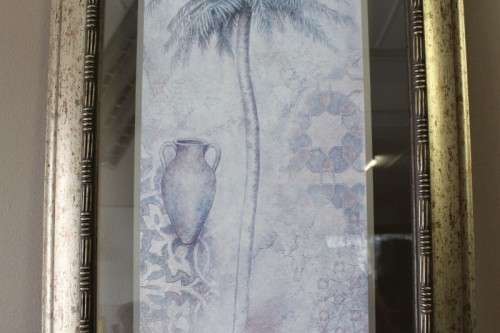 A beautifully composed print of a palm tree framed between glass in a mod wood frame Lifespace Sale