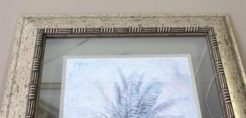 A beautifully composed print of a palm tree framed between glass in a mod wood frame Lifespace Sale