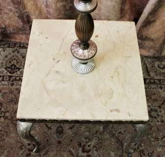 A beautiful decorative marble and brass free standing floor lamp with a large shade.