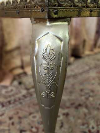 A beautiful decorative marble and brass free standing floor lamp with a large shade.