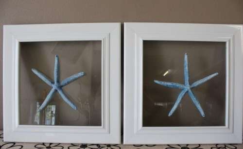 A fabulous set of real "Starfish" on a glass panel in a white frame. Stunning in all homes!!