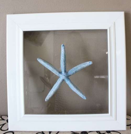 A fabulous set of real "Starfish" on a glass panel in a white frame. Stunning in all homes!!