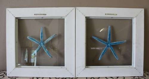 A fabulous set of real "Starfish" on a glass panel in a white frame. Stunning in all homes!!