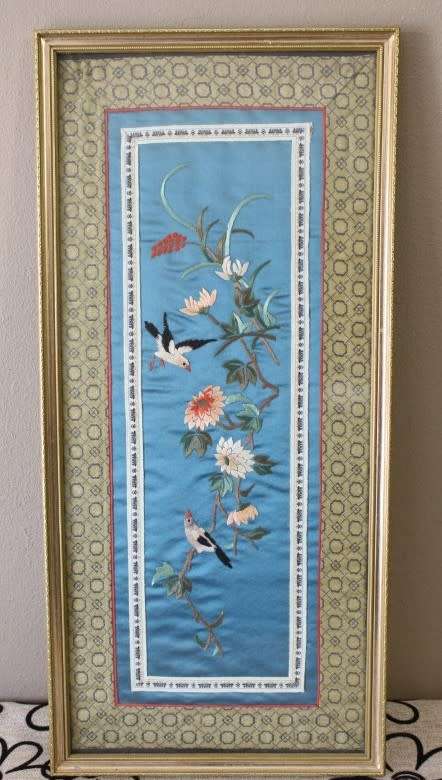 A beautiful vintage Japanese themed embroided on silk picture of a bird with flowers.