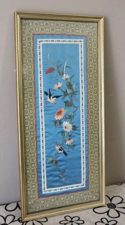 A beautiful vintage Japanese themed embroided on silk picture of a bird with flowers.