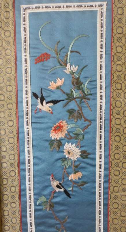 A beautiful vintage Japanese themed embroided on silk picture of a bird with flowers.