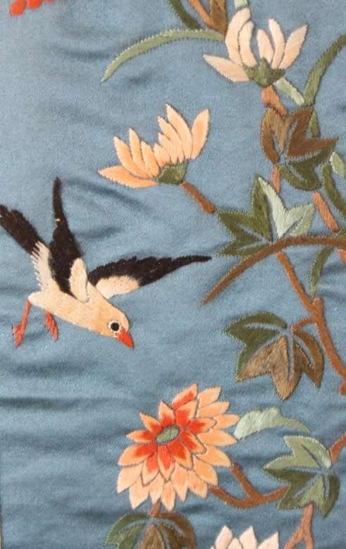 A beautiful vintage Japanese themed embroided on silk picture of a bird with flowers.