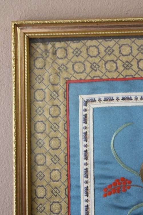 A beautiful vintage Japanese themed embroided on silk picture of a bird with flowers.